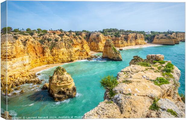 Spectacular cliffs and beach photographed near Praia da Marinha  Canvas Print by Laurent Renault