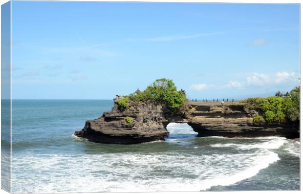 Pura Batu Bolong in the rock in Bali, Indonesia Canvas Print by Yann Tang