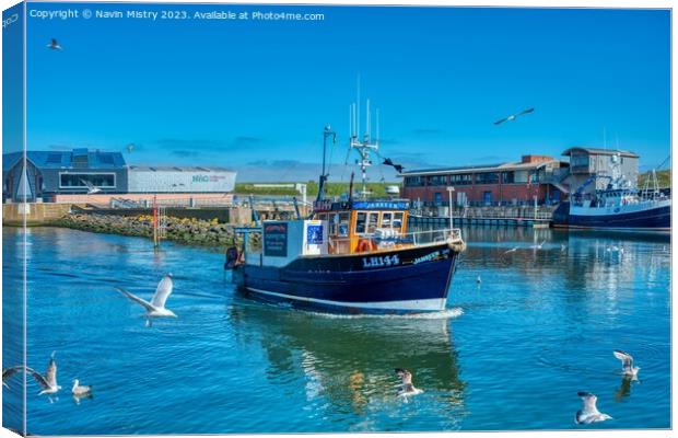 A Fishing Boat arrives in Eyemouth Harbour Canvas Print by Navin Mistry