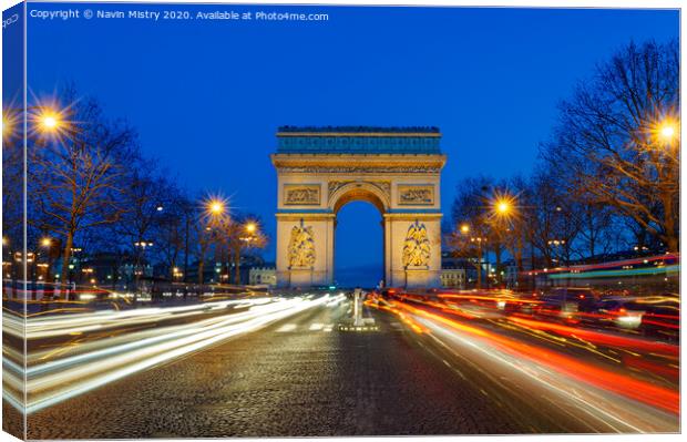 Arc de Triomphe de l'Étoile at night  Canvas Print by Navin Mistry