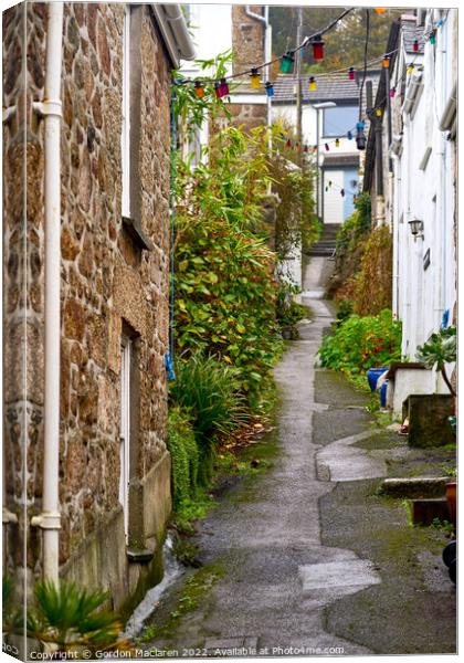 Picturesque street in Mousehole, Cornwall Canvas Print by Gordon Maclaren
