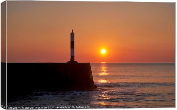 Sunset over Aberystwyth Breakwater and lighthouse Canvas Print by Gordon Maclaren