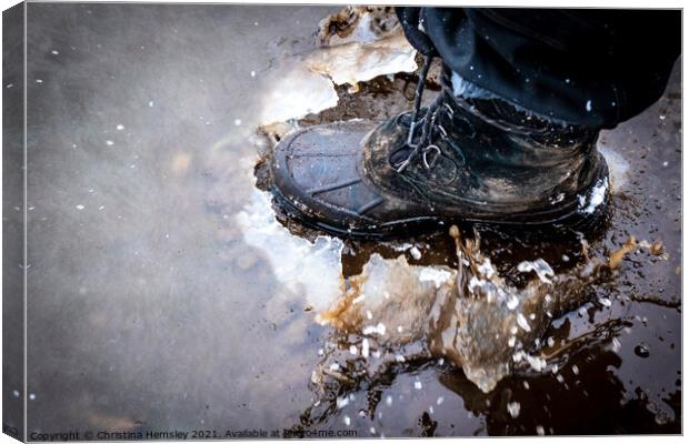 Boot cracking through an ice puddle Canvas Print by Christina Hemsley