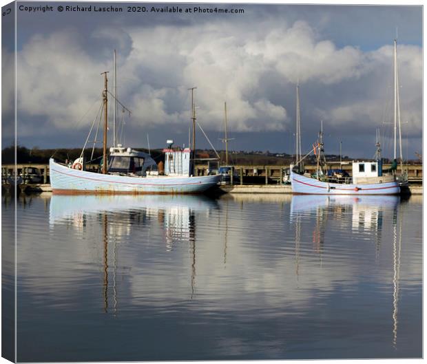 Sail boats anchored at the bay Canvas Print by Richard Laschon