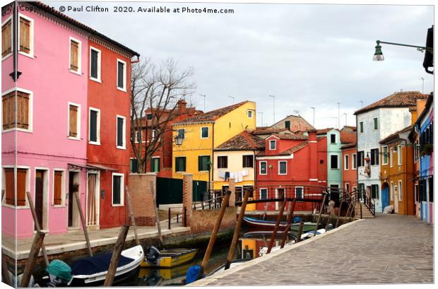 The pretty cottages on Burano island. Canvas Print by Paul Clifton