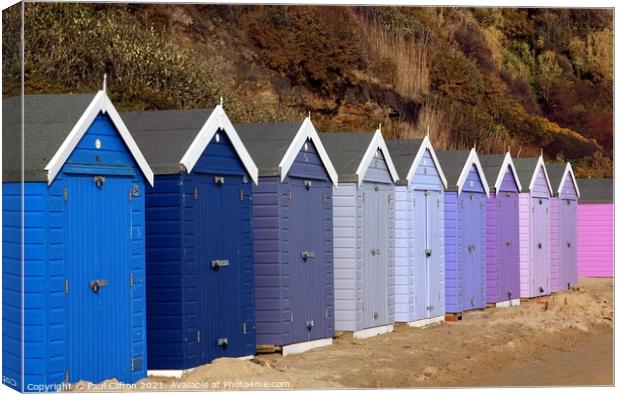 Bournemouth beach huts in harmony. Canvas Print by Paul Clifton