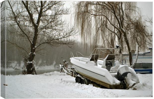 A boat covered in snow  Canvas Print by liviu iordache