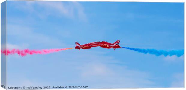 The Red Arrows Synchro Pair Canvas Print by Rick Lindley