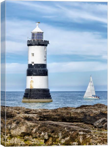 Sailing by Penmon Lighthouse Canvas Print by Rick Lindley