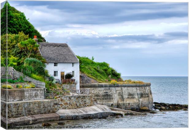 House By The Sea Canvas Print by Rick Lindley