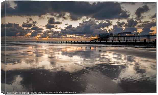 Sunrise Reflections on Cromer Beach North Norfolk  Canvas Print by David Powley