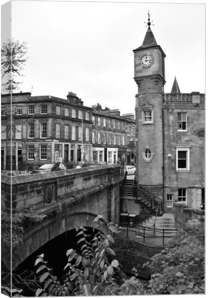Clocktower and bridge at Stockbridge Canvas Print by Theo Spanellis