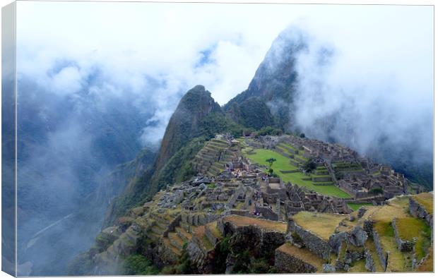 Machu Picchu in the mist Canvas Print by Theo Spanellis