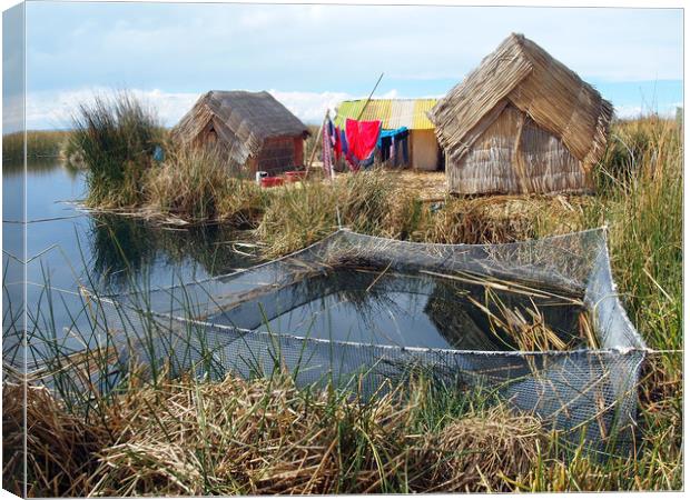 Traditional huts on Uros floating islands Canvas Print by Theo Spanellis