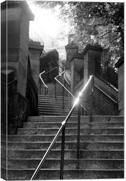 Sun shining on stairway railing Canvas Print by Theo Spanellis
