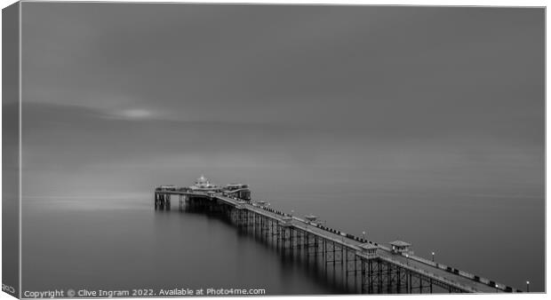 Serene Sunrise Over Iconic Welsh Pier Canvas Print by Clive Ingram