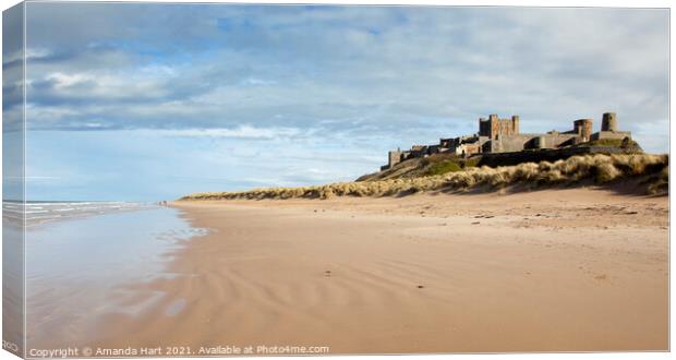 Bamburgh beach and castle, Northumberland Canvas Print by Amanda Hart