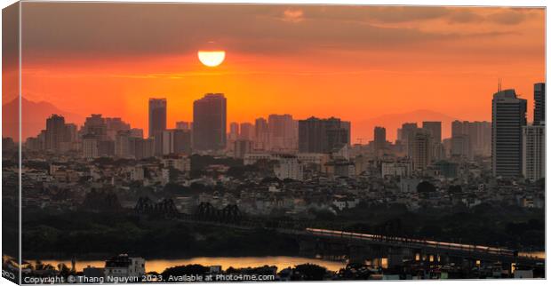 Sunset over Long Bien bridge with a train homing i Canvas Print by Thang Nguyen