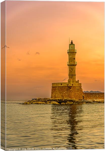 the lighthouse in the harbour of Chania glowing in the sunrise Canvas Print by Stig Alenäs