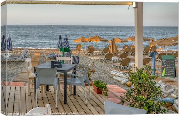 a Crete tavern on the beach with a view of the azure Mediterrane Canvas Print by Stig Alenäs