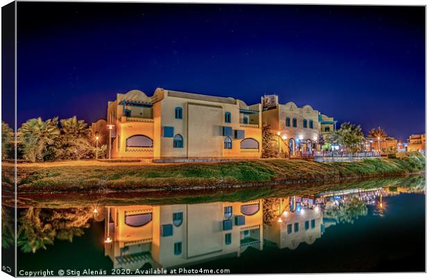 Egyptian houses at night reflecting in the lagoon Canvas Print by Stig Alenäs