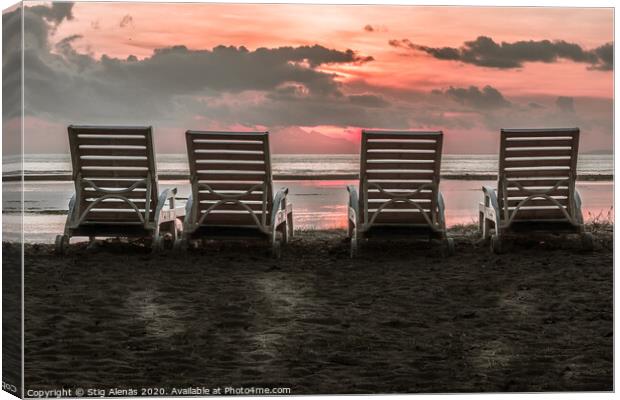 The backside of four chairs close to the beach in the tropical s Canvas Print by Stig Alenäs