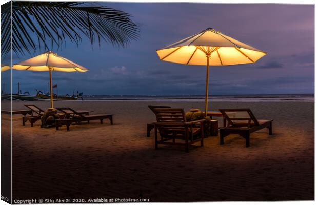 Umbrellas and sunbeds on the beach at night Canvas Print by Stig Alenäs