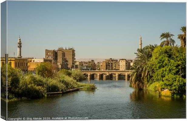 Egyptian town in the sunset , a view from a cruise on the Nile Canvas Print by Stig Alenäs