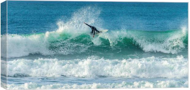 Surfer riding crest of wave, Fistral, Newquay, Cor Canvas Print by Mick Blakey