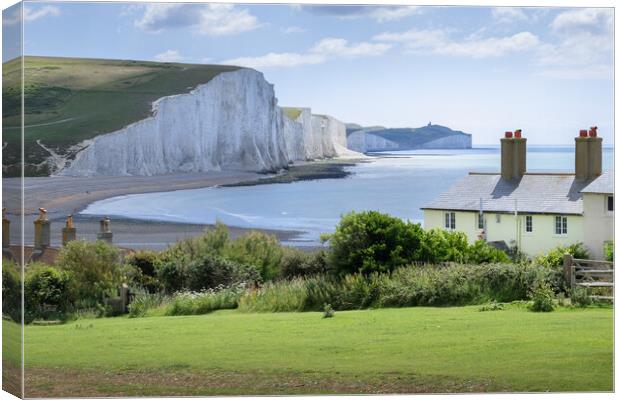 The Coastguard Cottages and the Seven Sisters Canvas Print by Mark Jones