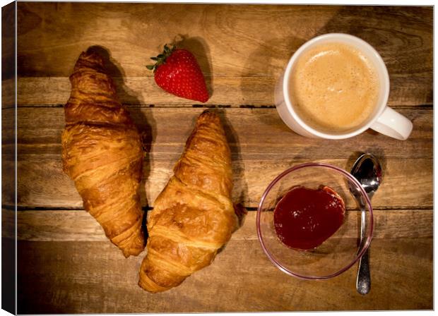 Breakfast table with coffee croissants and jam Canvas Print by Erik Lattwein