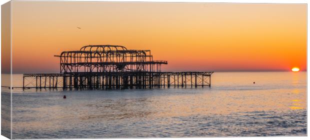 Old Brighton Pier in the sunset Canvas Print by Erik Lattwein