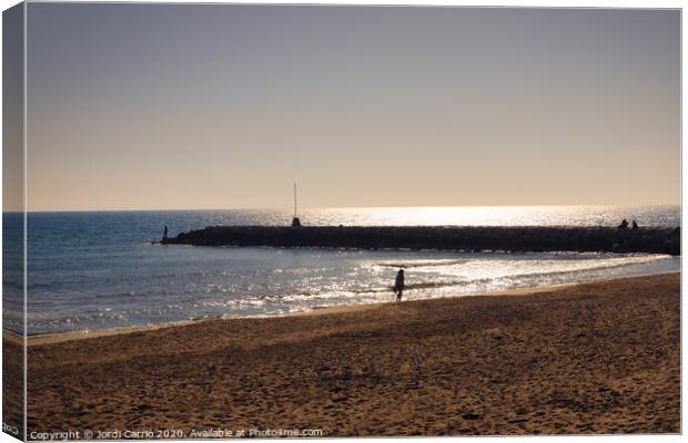 Against light of the beach of the Ribera de Sitges, Catalonia, S Canvas Print by Jordi Carrio