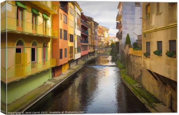 Painted houses bordering the Ritort river in Camprodon Canvas Print by Jordi Carrio