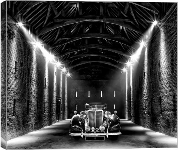 Classic MG lit up in a barn Canvas Print by Simon Marlow