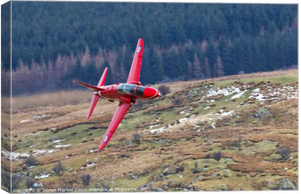Red Arrows Hawk low level in North Wales Canvas Print by Simon Marlow