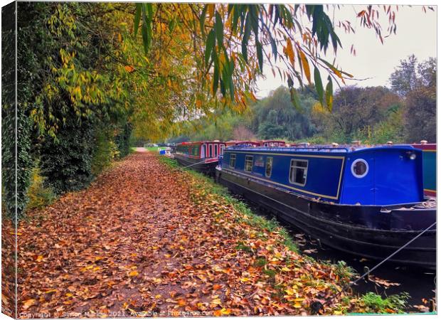 Barges on the canal at Aldermaston Wharf, Berkshire Canvas Print by Simon Marlow