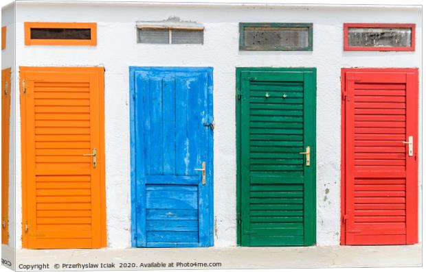 Colourful doors painted in orange, blue, green and Canvas Print by Przemek Iciak