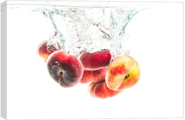 Bunch of doughnut peaches isolated on white, splashing into water. Canvas Print by Przemek Iciak