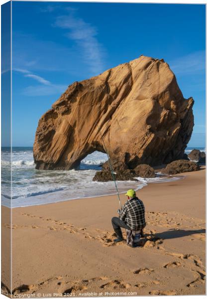 Fisherman in Praia de Santa Cruz beach rock boulder, Portugal Canvas Print by Luis Pina