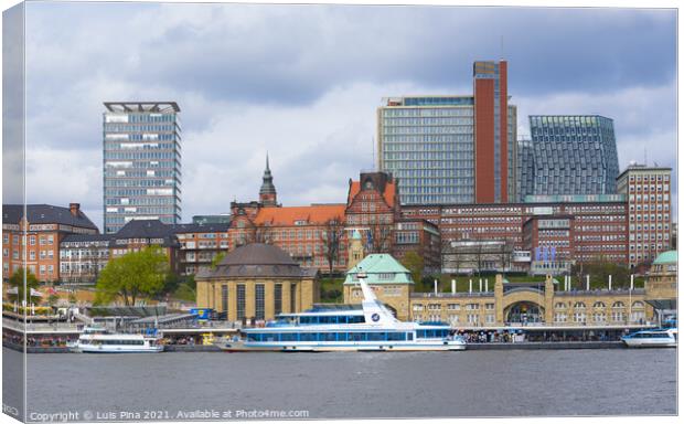 View of St. Pauli's Pier Landungsbrücken station tower with buildings and boats in Hamburg Canvas Print by Luis Pina