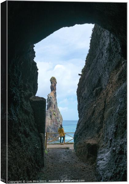 Girl looking at Ribeira da Janela islet between a cave in Madeira Canvas Print by Luis Pina