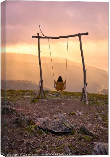 Woman girl social distancing swinging on a Swing baloico in Lousa mountain, Portugal at sunset Canvas Print by Luis Pina