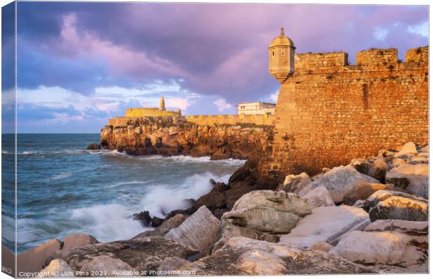 Peniche Fortress at sunset with beautiful golden light with sea waves crashing on the rocks, in Portugal Canvas Print by Luis Pina