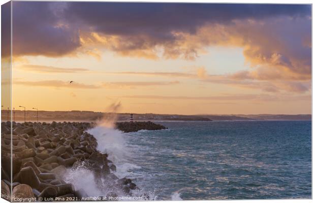 Peniche lighthouse with Supertubos beach on the background at sunset with waves crashing, in Portugal Canvas Print by Luis Pina