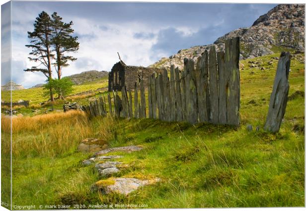 Slate wall and Chapel. Canvas Print by mark baker