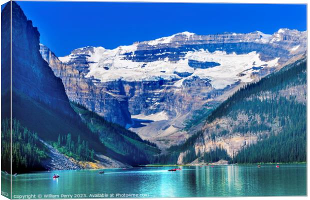 Lake Louise Canoes Snow Mountains Banff National Park Alberta Ca Canvas Print by William Perry