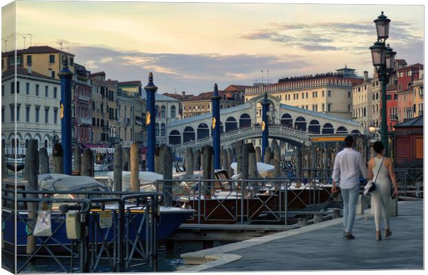 Venice, Italy A couple walking holding hands against rialto bridge, a famous place known as one of the romantic destination Canvas Print by Arpan Bhatia