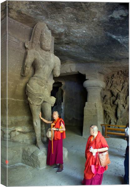 Mumbai, India - October 23, 2018: Interior of a Hindu God sculpture of Elephanta cave, late Gupta dating from between the 9th and 11th centuries, UNESCO World Heritage Site and buddhist monk tourist Canvas Print by Arpan Bhatia