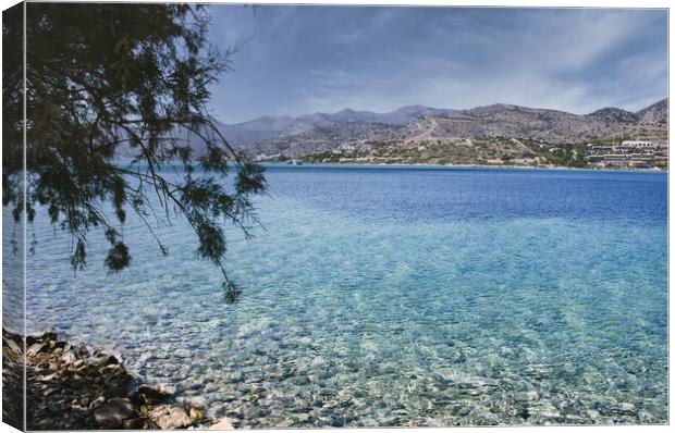 Crete or Kreta, Greece: View of the Mediterranean Sea against rocky terrain on Spinalonga island, formerly used as a leper colony, near Elounda, Mirabello Gulf Canvas Print by Arpan Bhatia